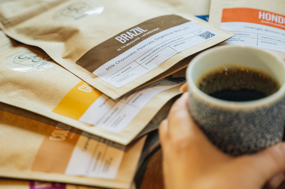 An image of Crosby Coffee's coffee beans and a cup of coffee