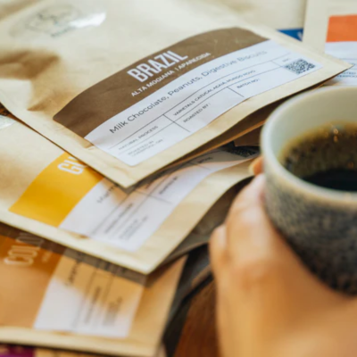 An image of Crosby Coffee's coffee beans and a cup of coffee