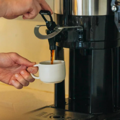 An image of a man pouring a coffee